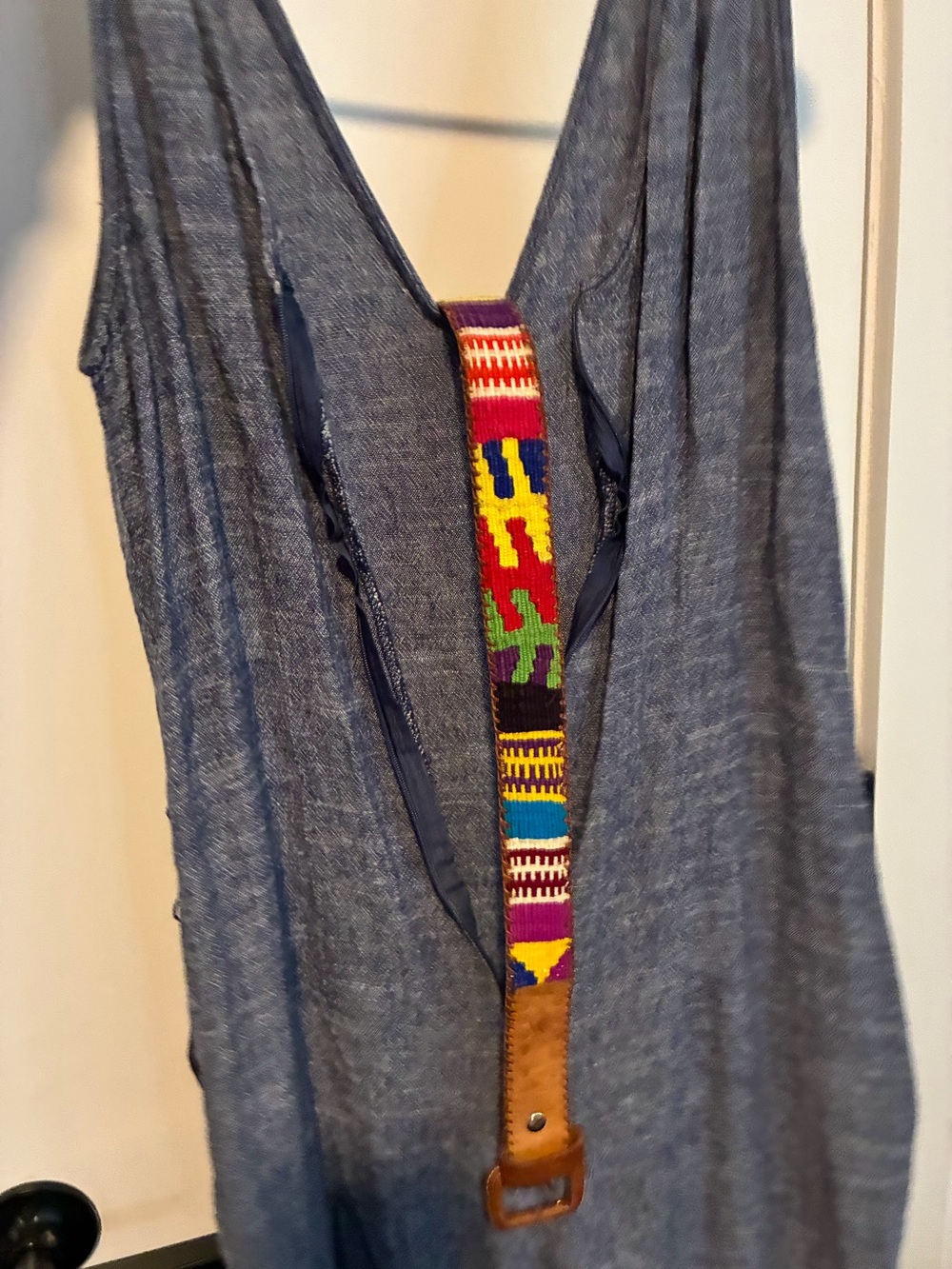 casual blue wide-leg jumpsuit with a textile belt